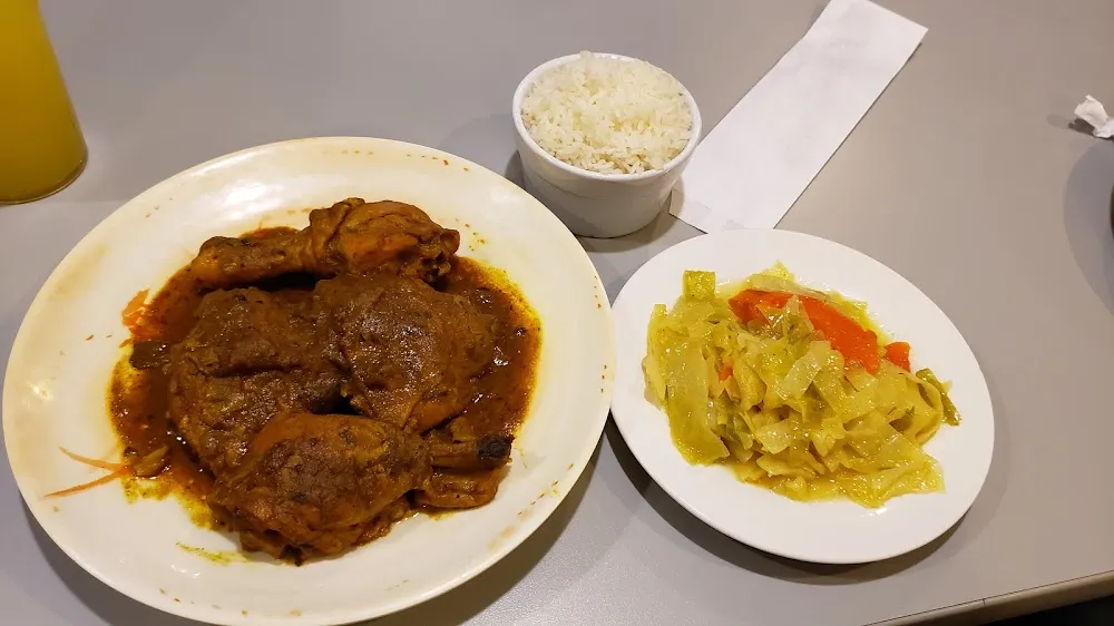 Curry Chicken and Side of Cabbage and Steamed Rice